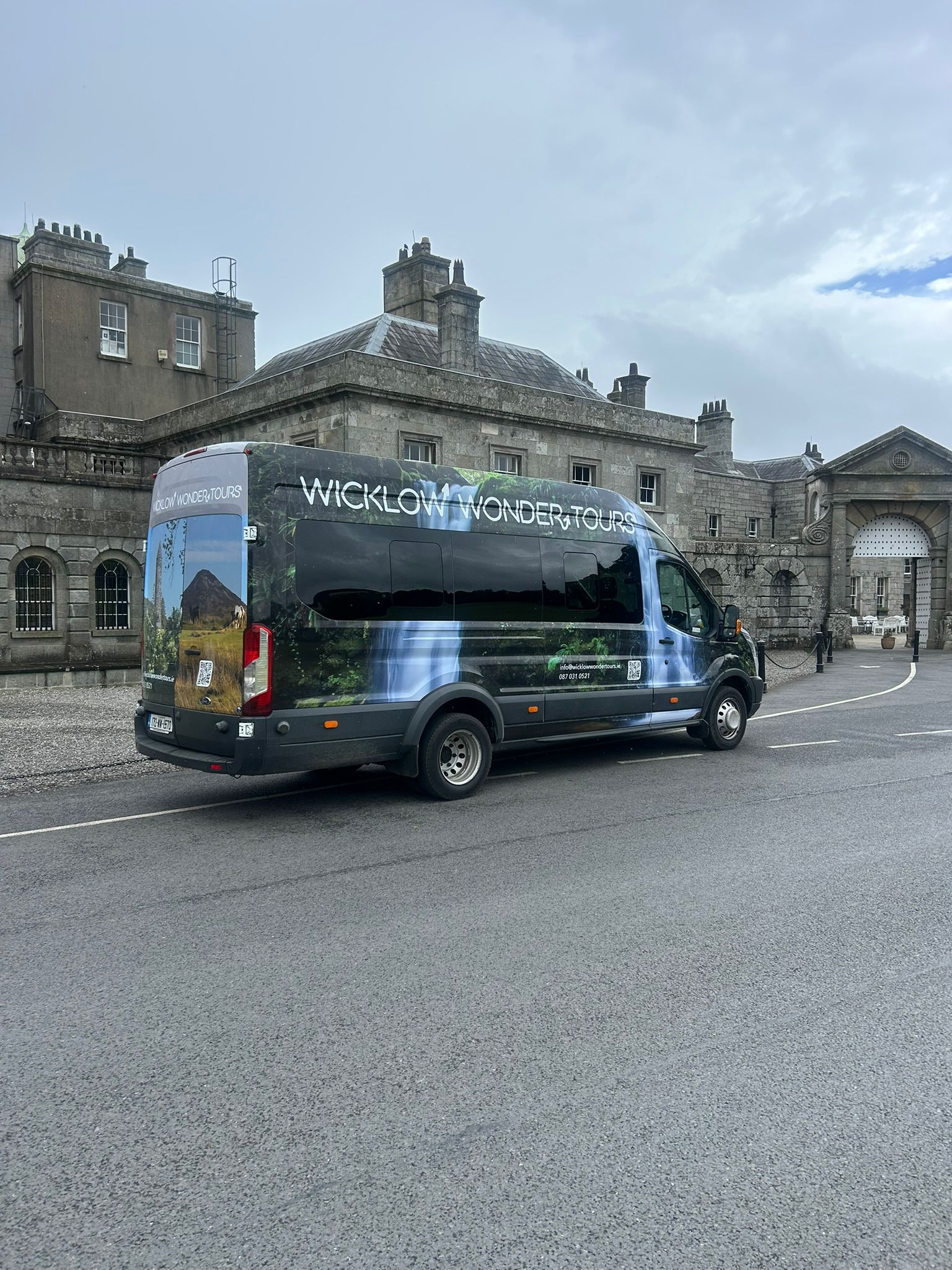Wicklow Wonder Tours Ford Transit minibus outside Powerscourt House